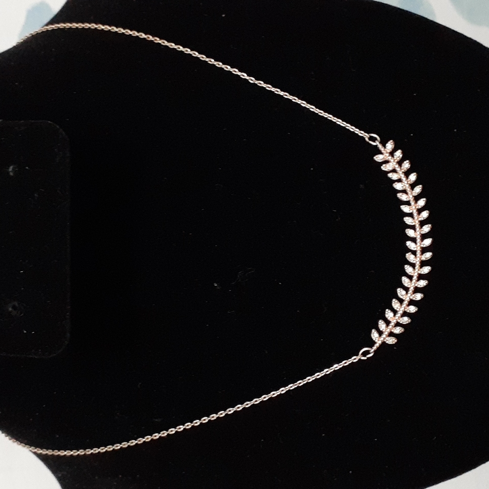 Rose Gold Tone Necklace With Attached Pendant